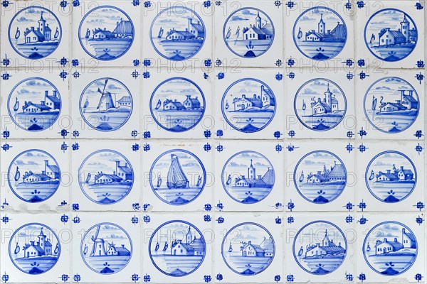 Old hand-painted Delftware tiles in a heated women's room in the only house on Suederoog Hallig