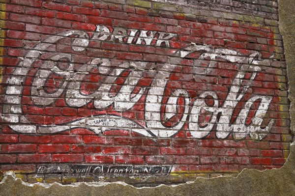 Old Coca-Cola advertising on a brick wall