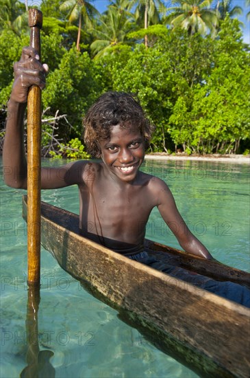 Local boy in a canoe in the Marovo Lagoon