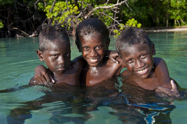 Local boys in the water of the Marovo Lagoon