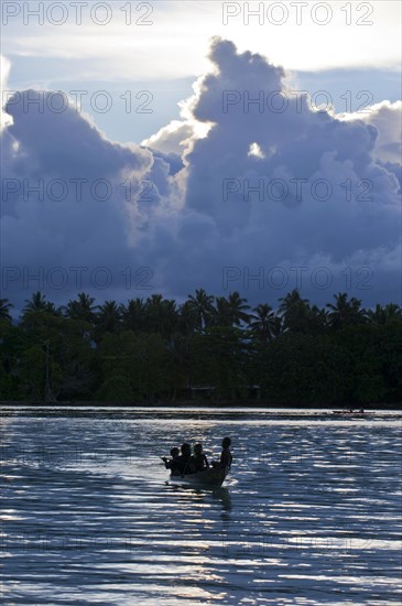 Boys in a canoe in the Marovo Lagoon