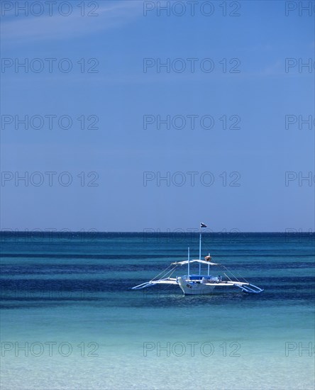 Banka or outrigger boat on the sea