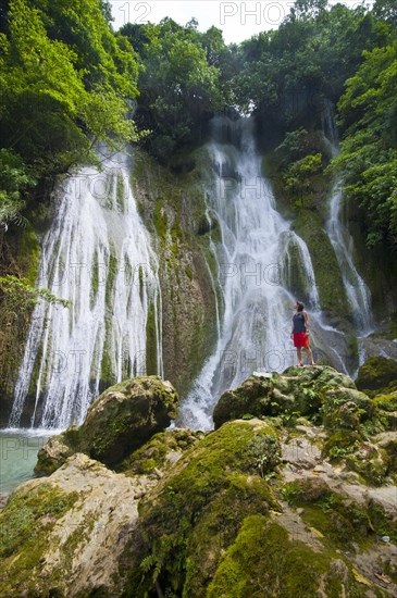 Woman looking at the Mele-Maat Cascades