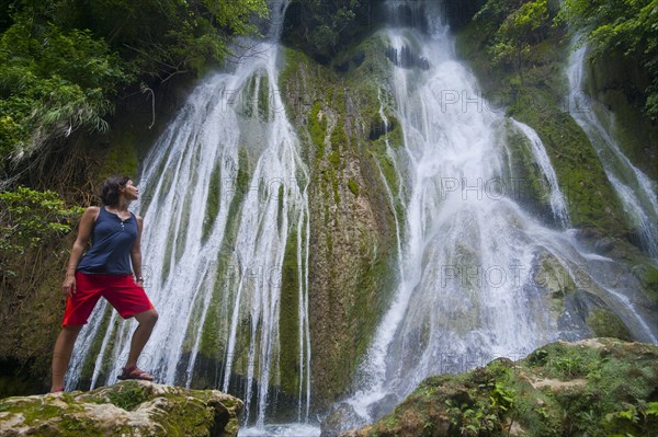 Woman looking at the Mele-Maat Cascades