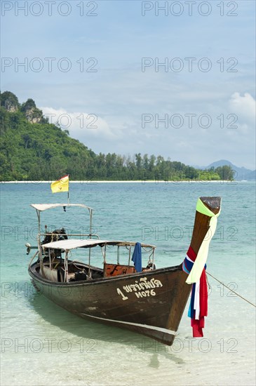 Longtail boat on a beach