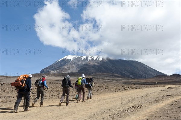 Group of hikers on a path at the Kibo saddle