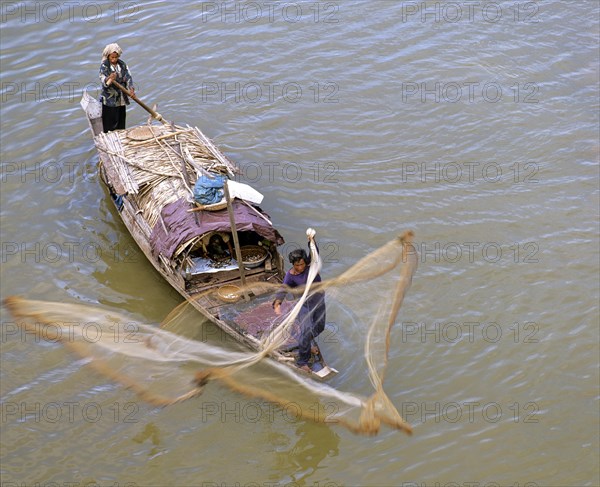 Fisherman casting his net