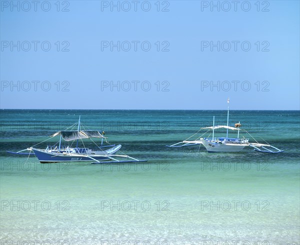 Two Bankas or outrigger boats on the sea