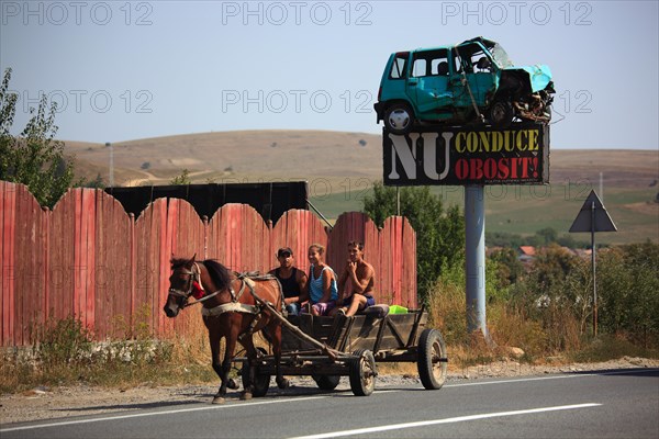 Horse-drawn carriage in traffic