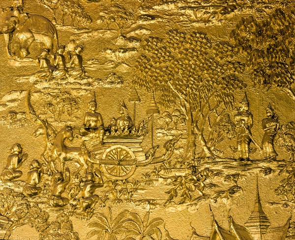 Gilded relief on the facade of Wat Mai Temple