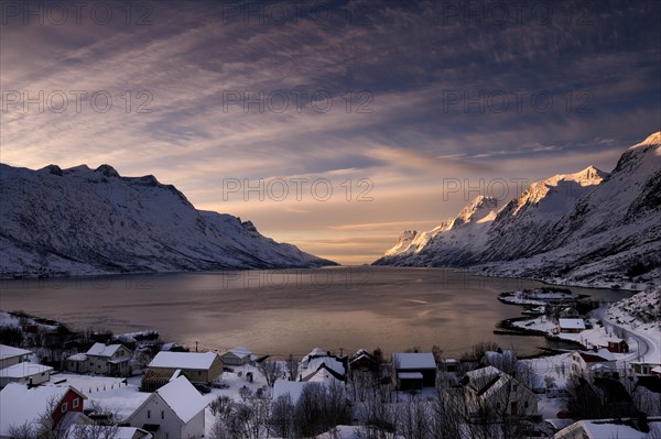 Fjord with small town in the evening light