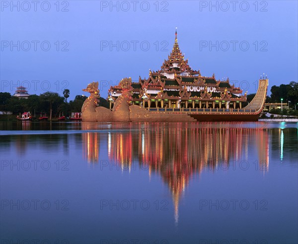 Karaweik ship restaurant on Lake Kandawgyi at dusk