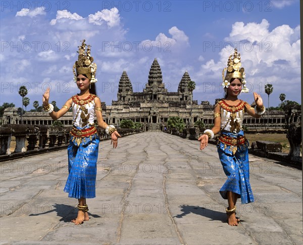 Temple dancers or apsaras on the western promenade in front of the temple of Angkor Wat