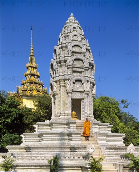 Monk on the stairs at the Kantha Bopha Stupa at the Silver Pagoda