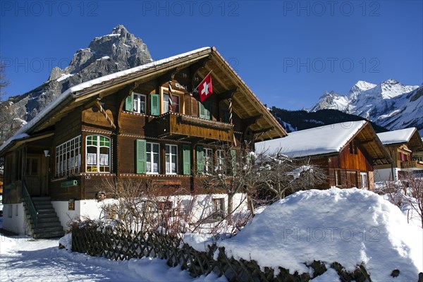 Chalet with a Swiss flag