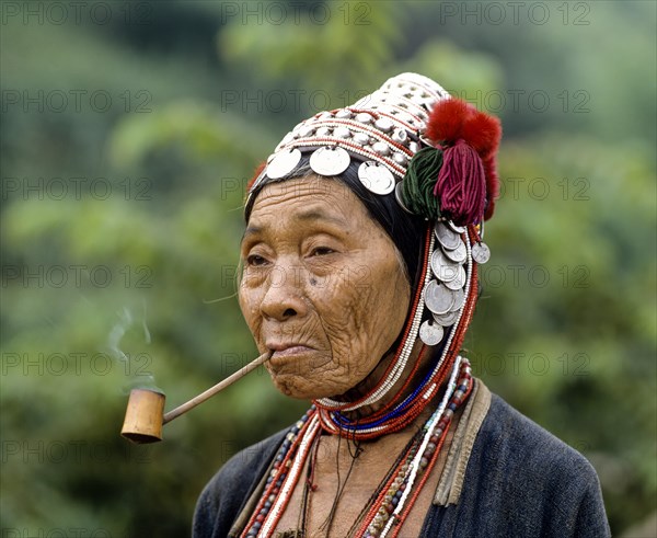 Akha woman with a pipe