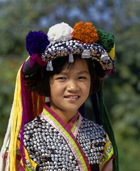 Lisu girl wearing a colourful headdress and the traditional costume of the mountain people