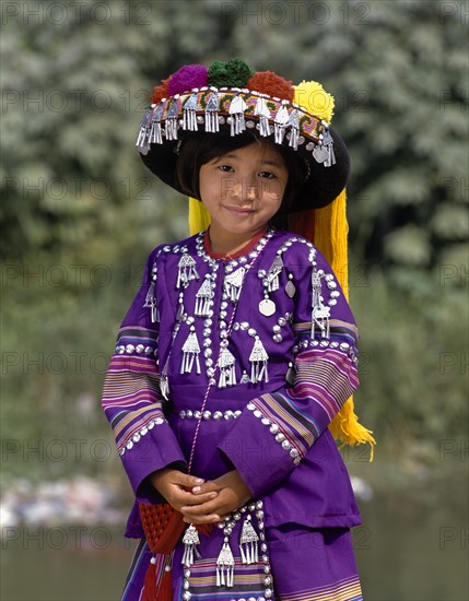 Lisu girl wearing a colourful headdress and the traditional costume of the mountain people