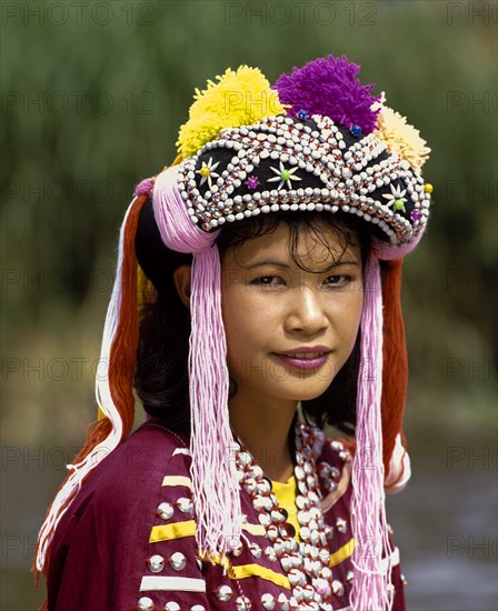 Lisu girl wearing a colourful headdress and the traditional costume of the mountain people