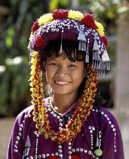 Lisu girl wearing a colourful headdress and the traditional costume of the mountain people