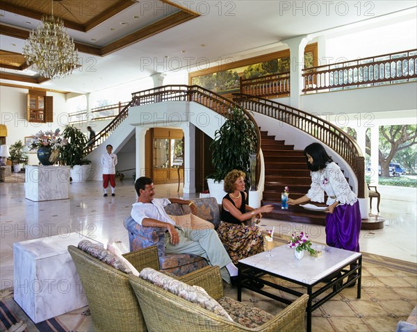 Tourists in the lobby of the Sofitel Centara Grand Resort