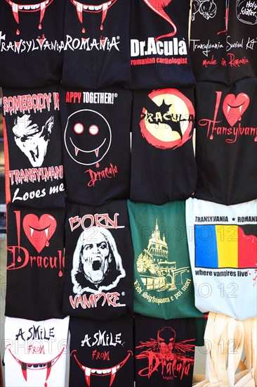 T-shirts with Dracula and vampire designs in a souvenir shop