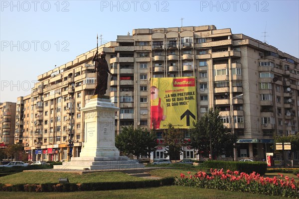 Prefabricated concrete apartment building with a large advertising poster for a hardware store