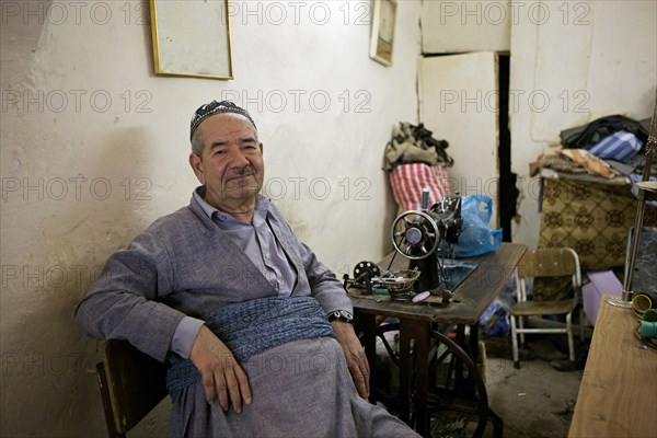 Tailor in a tailor store