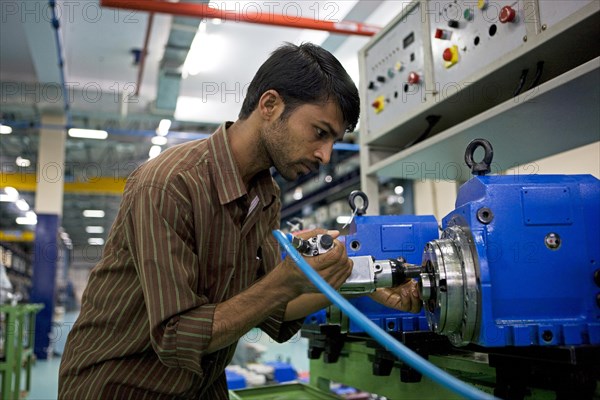 Worker on the shop floor of a supplier for the German engineering company Mao Deckel