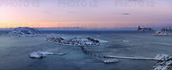 Fjord with islands and a bridge during the blue hour