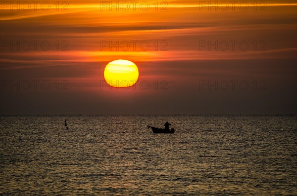 Fishing boat at sunrise