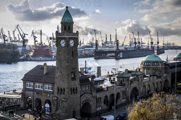 Water level tower of St. Pauli Landing Bridges in front of the Blohm + Voss shipyard with cranes