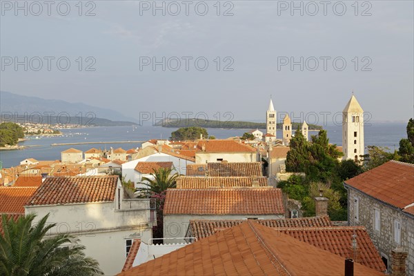 Four church steeples above the roofs of the historic town centre