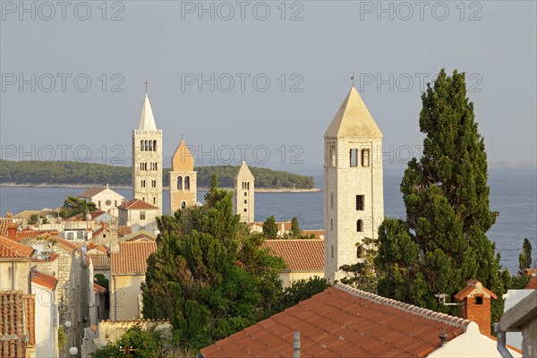 Four church steeples above the roofs of the historic town centre