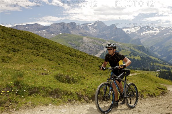 Mountain biker in the Alps near Lauenen