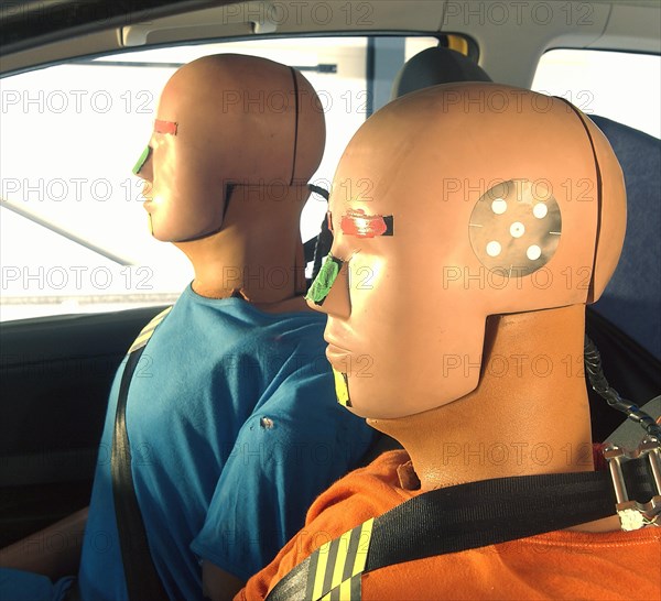 Crash test dummies in a car