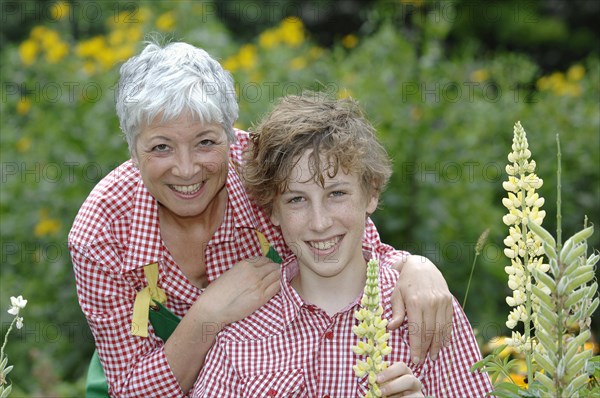 Grandmother and grandson in a garden