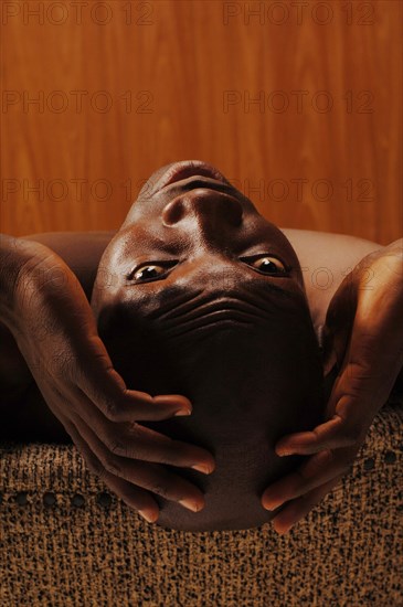 Young man with his hands on his head