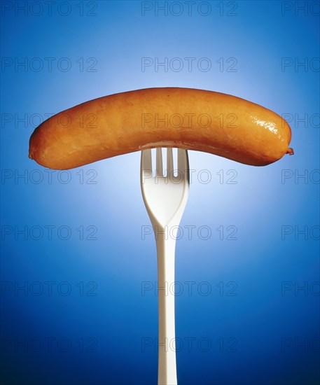 Sausage on a plastic fork