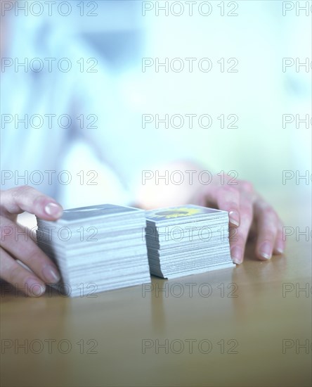 Hands with two stacks of memory cards
