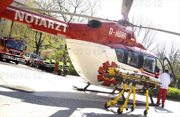 Helicopter in operation with emergency medical and fire services in the city