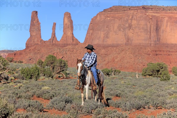 Navajo cowboy riding on a Mustang