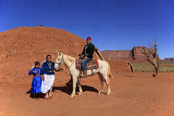 Navajo Indian family with a horse