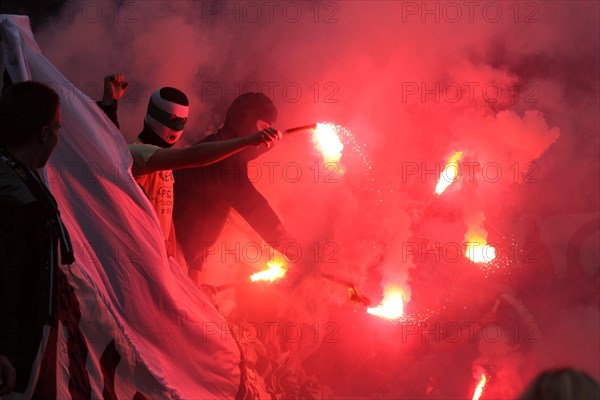 Gladbach fans lighting firecrackers