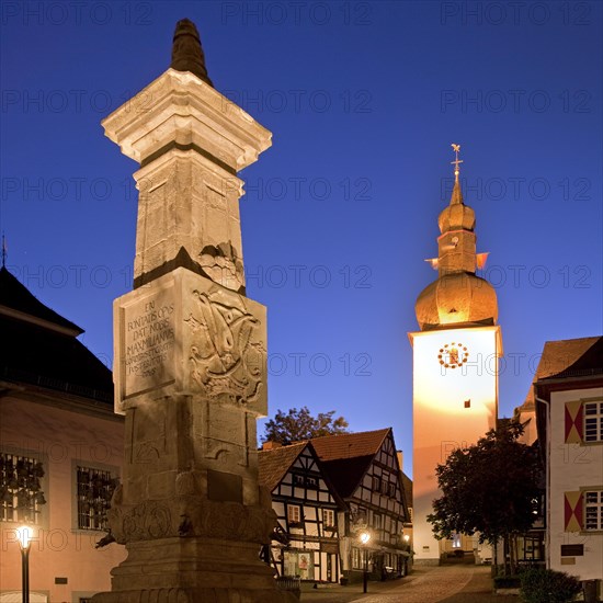 Maximilian Fountain in Alter Markt square with the old town hall and the bell tower at dusk