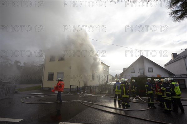 Firefighters fighting a house fire