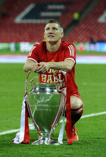 Bastian Schweinsteiger with the trophy