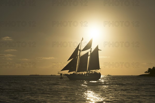 Sailing ship at sunset