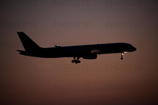 Aircraft approaching Dalaman Airport at dusk