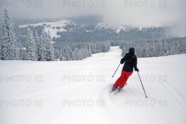 Female skier on a slope